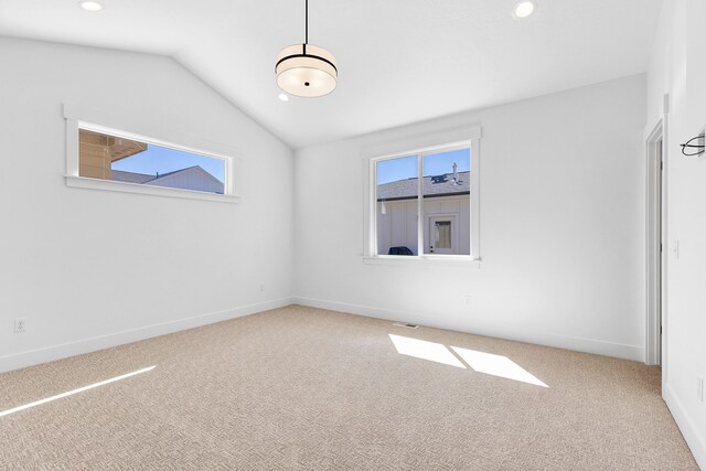 5665 Cattle Dr, Missoula, MT 59808 - empty room with plenty of natural light, carpet flooring, recessed lighting, vaulted ceiling, and baseboards