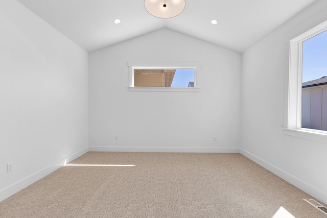 5665 Cattle Dr, Missoula, MT 59808 - carpeted empty room featuring plenty of natural light, vaulted ceiling, baseboards, and recessed lighting