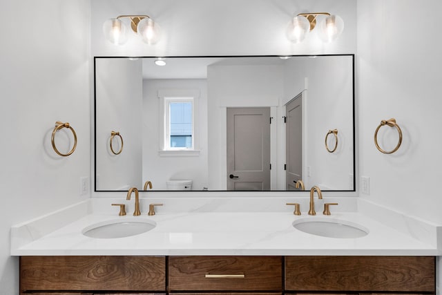 5665 Cattle Dr, Missoula, MT 59808 - full bathroom featuring toilet and double vanity