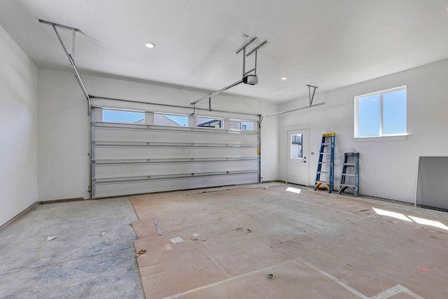 5665 Cattle Dr, Missoula, MT 59808 - garage with a garage door opener and recessed lighting