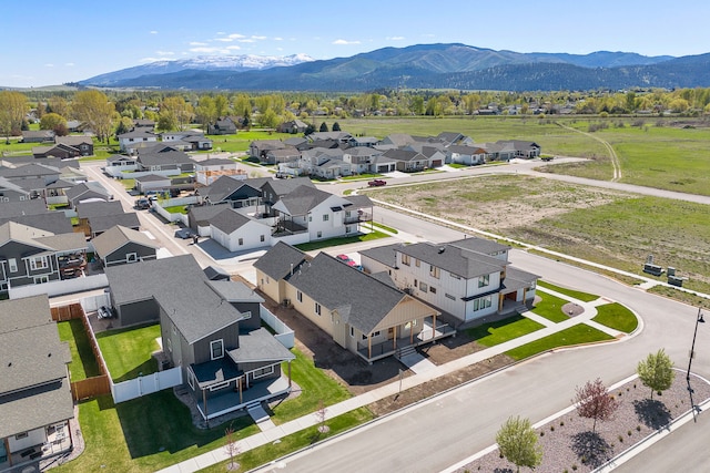 5665 Cattle Dr, Missoula, MT 59808 - aerial perspective of suburban area with a mountain backdrop