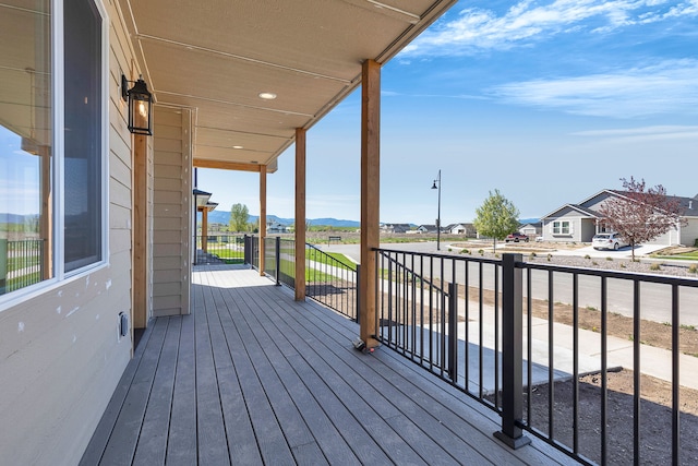 5665 Cattle Dr, Missoula, MT 59808 - wooden terrace featuring a mountain view and a residential view