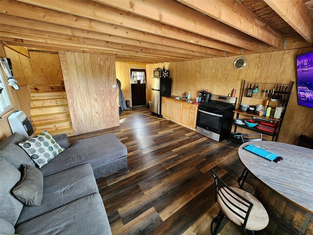199 Bitterroot Ridge Ln, Cascade, MT 59421 - living room featuring beam ceiling, wooden walls, a wall unit AC, and dark wood-style flooring