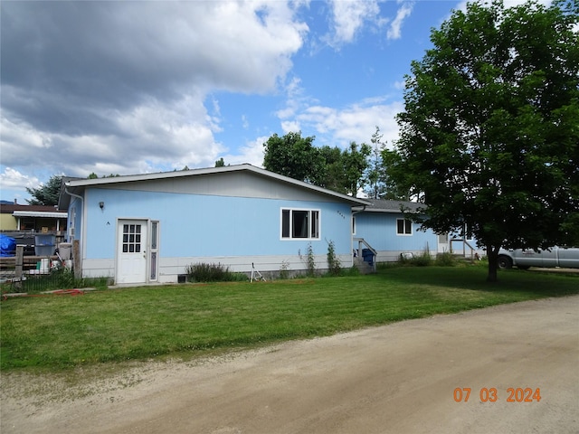 6445 Mullan Rd, Missoula, MT 59808 - view of side of home with a yard