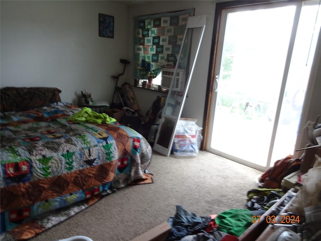 6445 Mullan Rd, Missoula, MT 59808 - carpeted bedroom with multiple windows and access to outside
