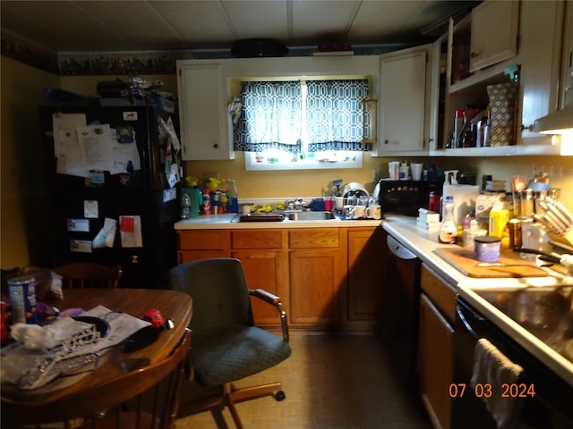 6445 Mullan Rd, Missoula, MT 59808 - kitchen with black appliances, light countertops, and brown cabinets