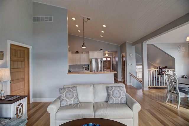 23877 3rd St, Dayton, MT 59914 - living area with wood finished floors, high vaulted ceiling, recessed lighting, and wood ceiling