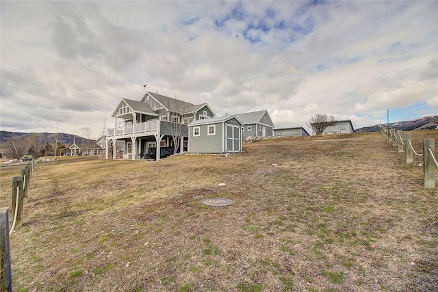 23877 3rd St, Dayton, MT 59914 - rear view of property with a shed and a wooden deck