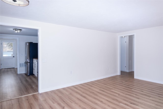 1613 Main Ave, Libby, MT 59923 - unfurnished room featuring light wood-style flooring and baseboards