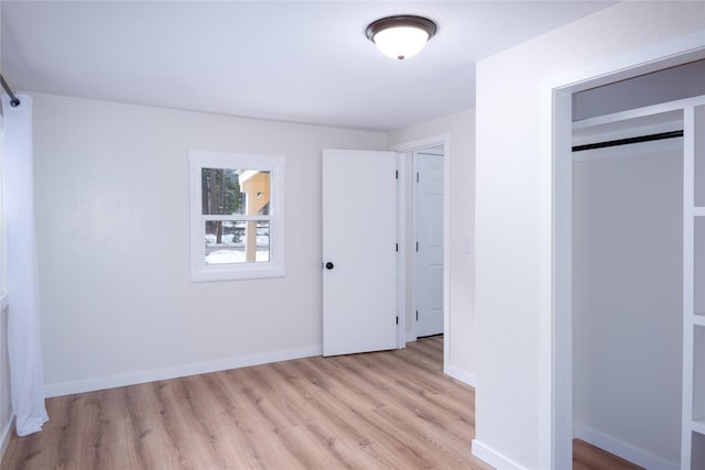 1613 Main Ave, Libby, MT 59923 - unfurnished bedroom featuring light wood-type flooring and baseboards