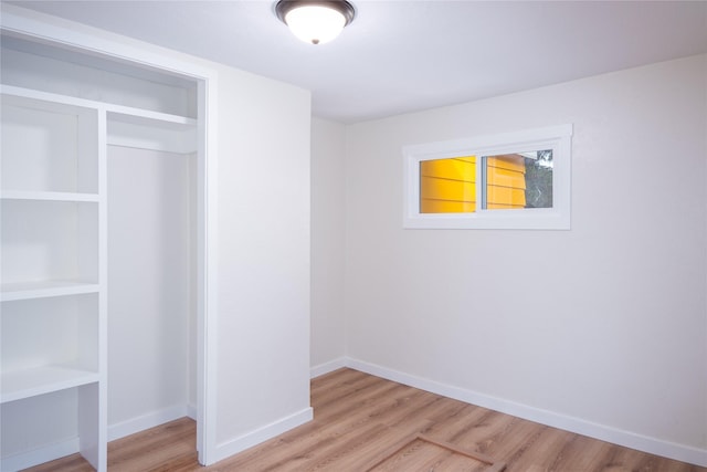 1613 Main Ave, Libby, MT 59923 - unfurnished bedroom featuring light wood-style flooring and a closet