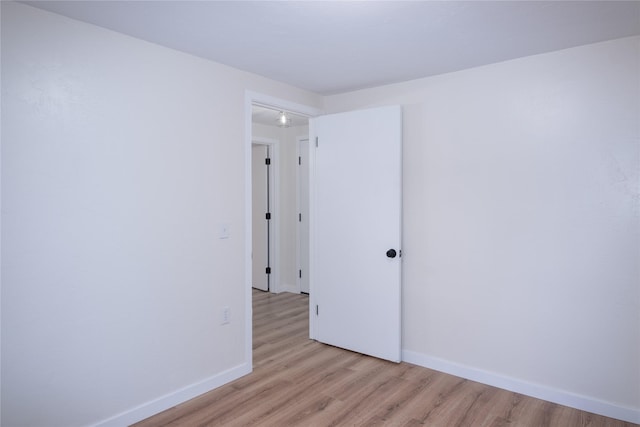 1613 Main Ave, Libby, MT 59923 - empty room featuring light wood-style floors and baseboards