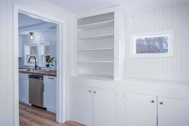 1613 Main Ave, Libby, MT 59923 - detailed view of stainless steel dishwasher, a sink, and wood finished floors