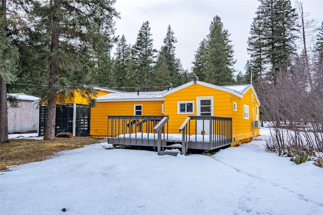 1613 Main Ave, Libby, MT 59923 - snow covered house featuring a wooden deck