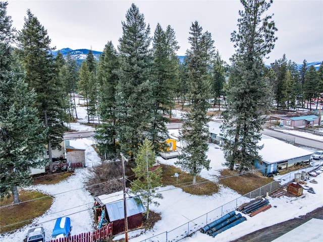 1613 Main Ave, Libby, MT 59923 - snowy aerial view featuring a mountain view