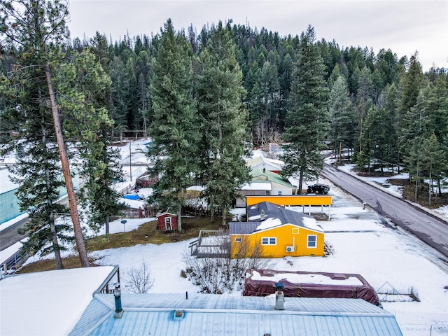 1613 Main Ave, Libby, MT 59923 - snowy aerial view featuring a forest view