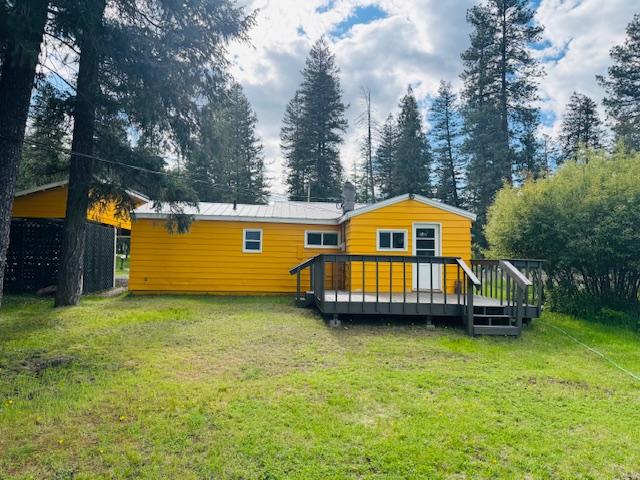 1613 Main Ave, Libby, MT 59923 - rear view of house with a yard and a wooden deck