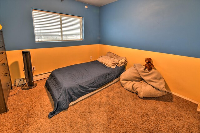 873 Guthrie Rd, Helena, MT 59602 - carpeted bedroom featuring baseboard heating and a baseboard heating unit