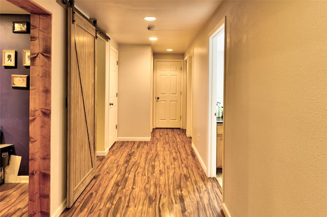 873 Guthrie Rd, Helena, MT 59602 - corridor featuring baseboards, recessed lighting, a barn door, and wood finished floors
