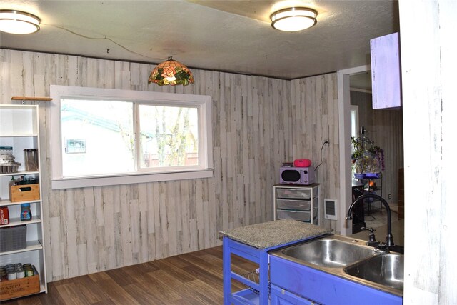 carpeted bedroom with wooden walls