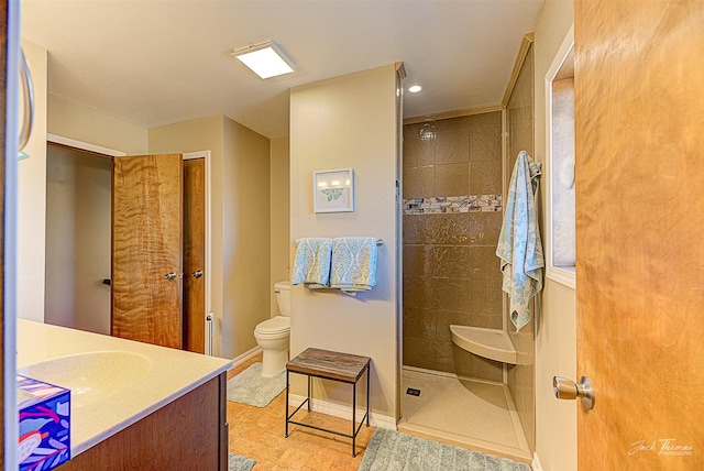 bathroom featuring walk in shower, toilet, baseboards, vanity, and recessed lighting