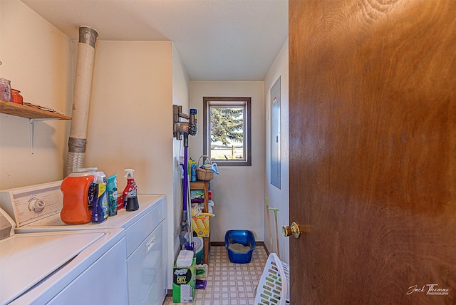 washroom with washing machine and dryer, tile patterned floors, and baseboards