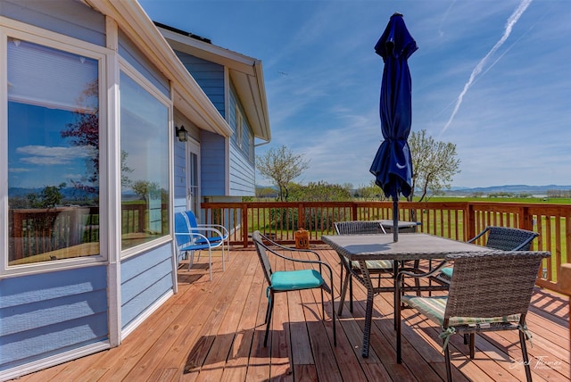 deck featuring outdoor dining area
