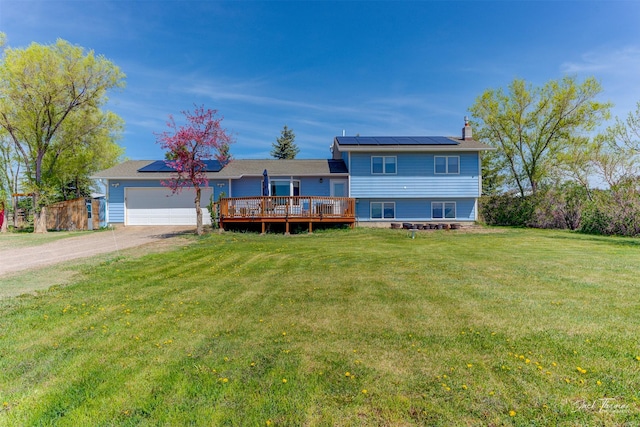 split level home with a chimney, solar panels, dirt driveway, and a front yard