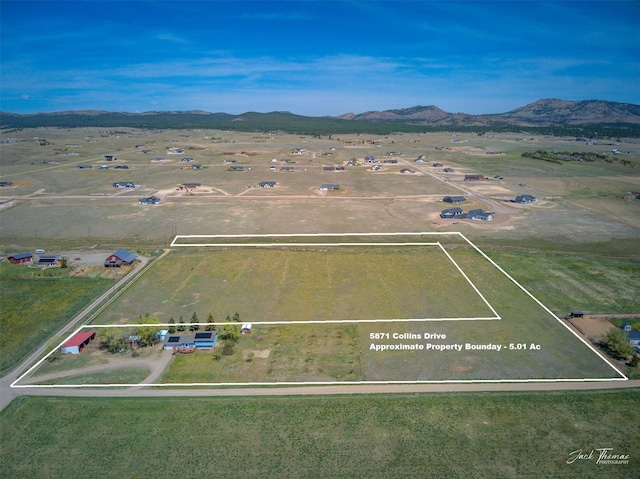 aerial view of property's location featuring property parcel outlined and mountains
