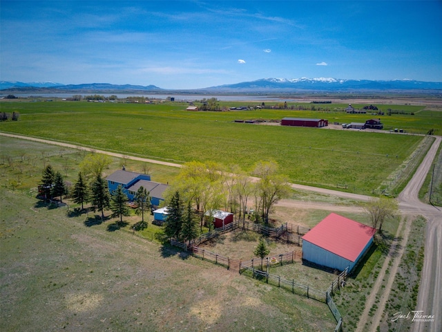 overview of rural landscape with agricultural land and a mountain backdrop