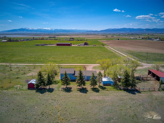 overview of rural landscape with a mountainous background and agricultural land