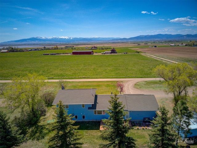 aerial view of sparsely populated area featuring a mountain backdrop