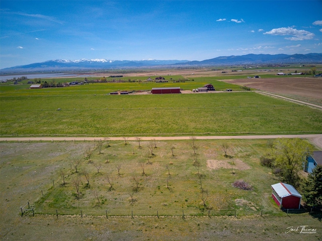 view of mountain background with rural landscape and agricultural land