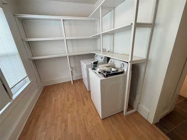 1022 Lewisohn St, Butte, MT 59701 - washroom with washing machine and dryer and light wood-style flooring