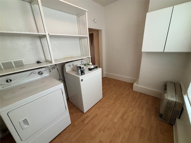 1022 Lewisohn St, Butte, MT 59701 - laundry area featuring washer and clothes dryer and light wood-style floors