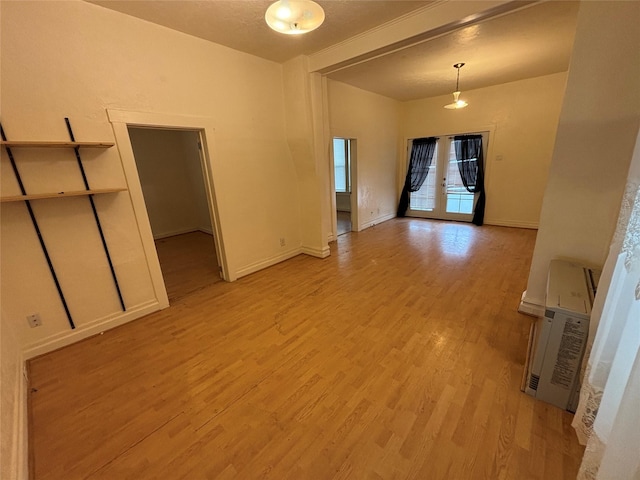 1022 Lewisohn St, Butte, MT 59701 - empty room featuring light wood finished floors and french doors