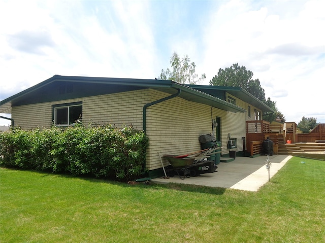 117 Rocky Mountain Ln, Butte, MT 59701 - view of side of home featuring a patio and a lawn