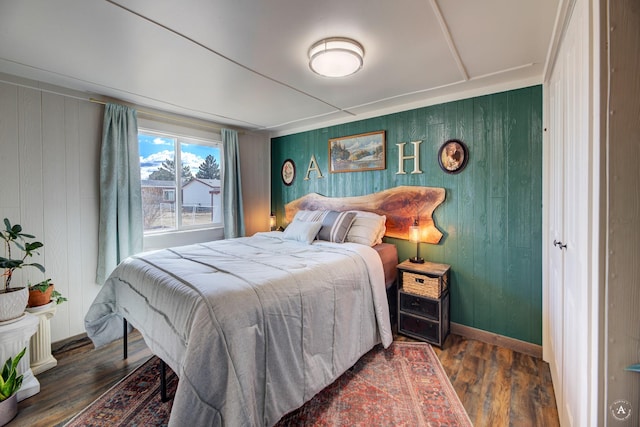 2931 Melrose Rd, Helena, MT 59602 - bedroom with wood finished floors, wooden walls, and baseboards