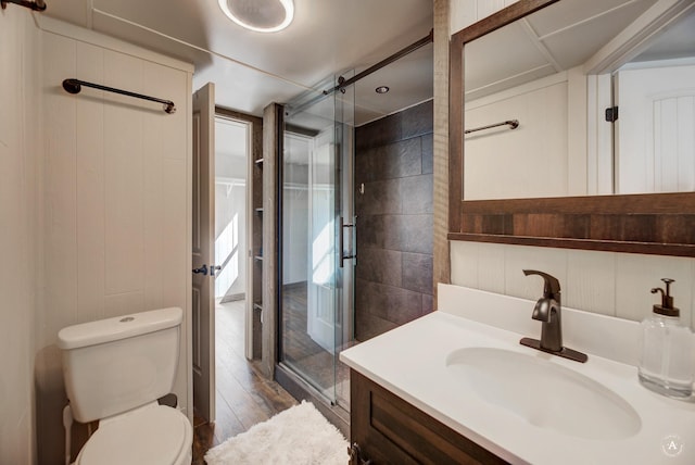 2931 Melrose Rd, Helena, MT 59602 - bathroom with a stall shower, vanity, toilet, and wood finished floors