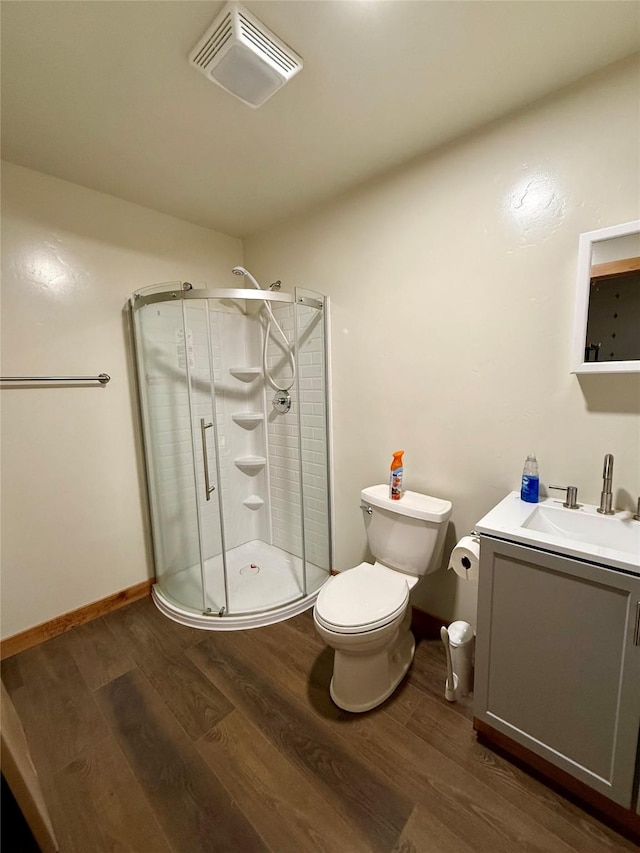 421 Cherry Creek Rd, Thompson Falls, MT 59873 - full bath featuring vanity, wood finished floors, visible vents, and a shower stall