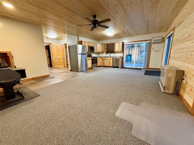 421 Cherry Creek Rd, Thompson Falls, MT 59873 - unfurnished living room featuring wooden ceiling, a ceiling fan, a sink, and baseboards