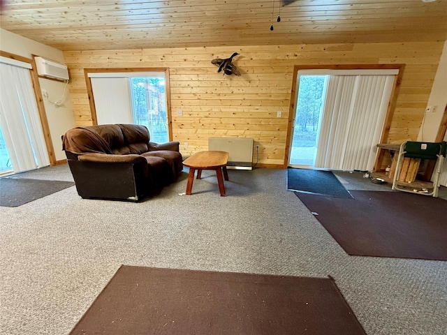 421 Cherry Creek Rd, Thompson Falls, MT 59873 - living area with a wall mounted AC, carpet, wooden walls, and wooden ceiling