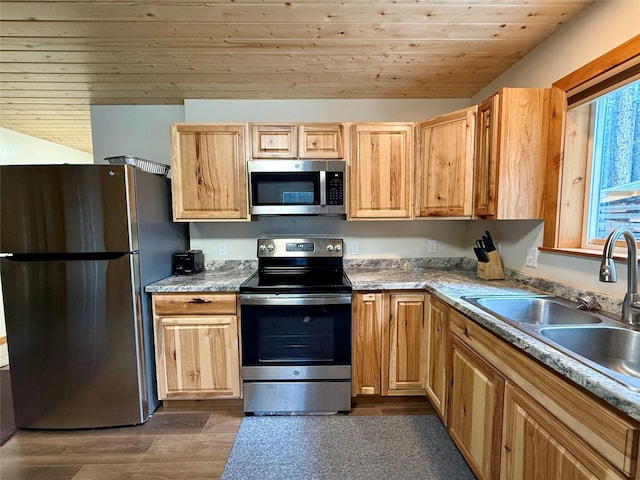 421 Cherry Creek Rd, Thompson Falls, MT 59873 - kitchen with light brown cabinetry, a sink, dark wood-type flooring, wood ceiling, and appliances with stainless steel finishes