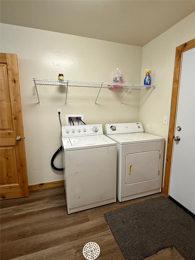 421 Cherry Creek Rd, Thompson Falls, MT 59873 - washroom featuring washer and clothes dryer, wood finished floors, and baseboards