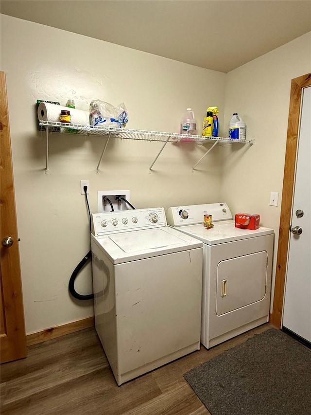 421 Cherry Creek Rd, Thompson Falls, MT 59873 - washroom with washing machine and dryer, wood finished floors, baseboards, and laundry area