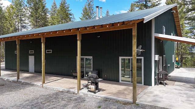 421 Cherry Creek Rd, Thompson Falls, MT 59873 - rear view of house with a patio area and metal roof