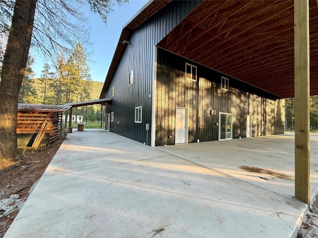 421 Cherry Creek Rd, Thompson Falls, MT 59873 - view of outdoor structure featuring a carport and concrete driveway