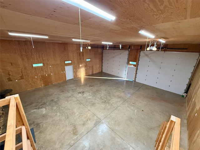 421 Cherry Creek Rd, Thompson Falls, MT 59873 - garage featuring wood walls and a garage door opener