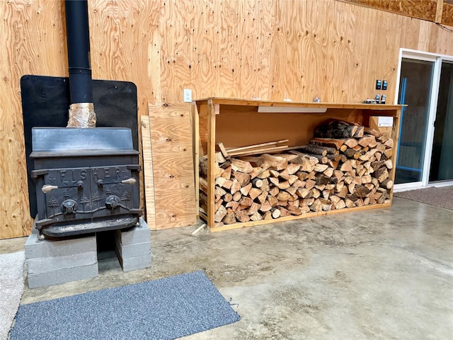 421 Cherry Creek Rd, Thompson Falls, MT 59873 - miscellaneous room featuring concrete floors and a wood stove