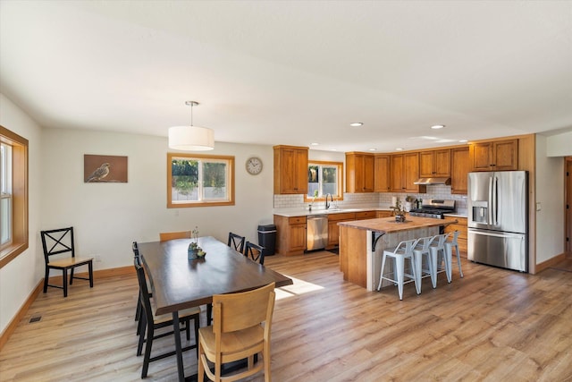 140 Swan River Rd, Bigfork, MT 59911 - dining space with light wood finished floors and recessed lighting